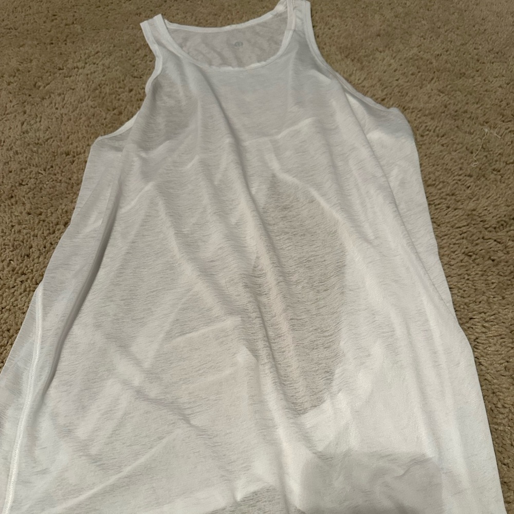 Lululemon white open back tank. Inner tag missing but guessing an 8.